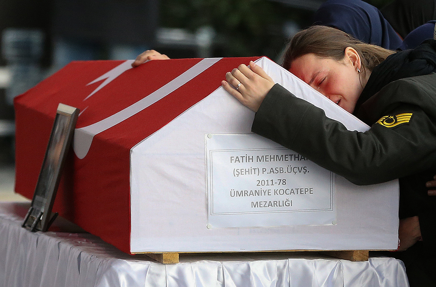 Wife Gamze Mehmethan of Fatih Mehmethan, a Turkish soldier who was killed in a cross-border clashes Kurdish Popular Protection Units (YPG) forces at Afrin, mourn over his coffin during a funeral ceremony in Istanbul, Turkey, 28 January 2018.
