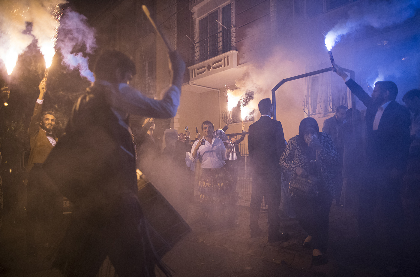 Osman Celik (C) dancing during  a wedding while people hold torch in Istanbul, Turkey, 16 November 2019.