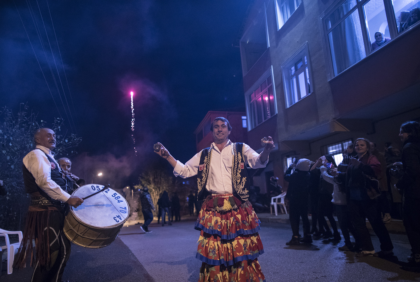 Osman Celik (C) dance while firework seen on background during a entertainment of a boy which will do soon compulsory military service in Istanbul, Turkey, 01 December 2019. 
