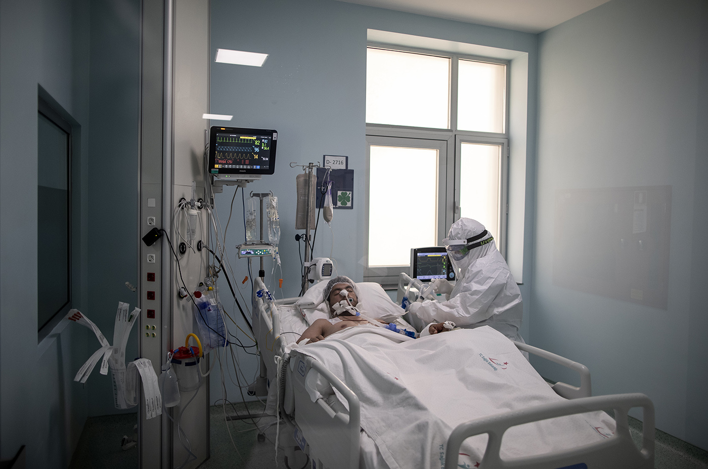 A medical worker wearing Personal Protective Equipment (PPE) attends to a COVID-19 patient at intensive care of the Sancaktepe Martyr Prof Dr Ilhan Varank Training and Research Hospital in Istanbul, Turkey, 11 May 2020.