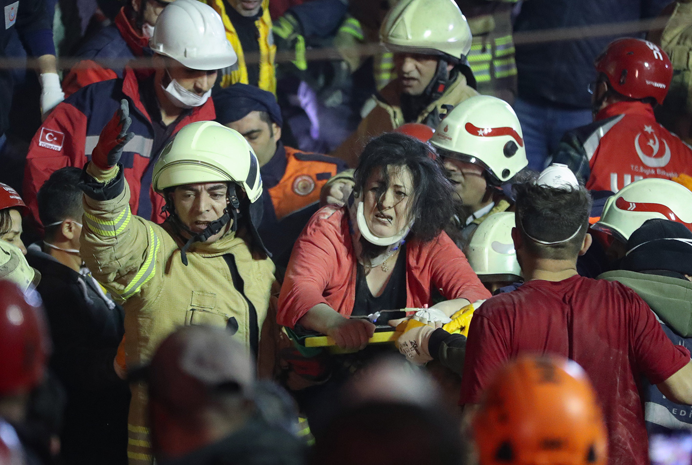 Rescuers carry an injured woman on a stretcher from the site of a collapsed building in Kartal district of Istanbul, Turkey, 06 February 2019.