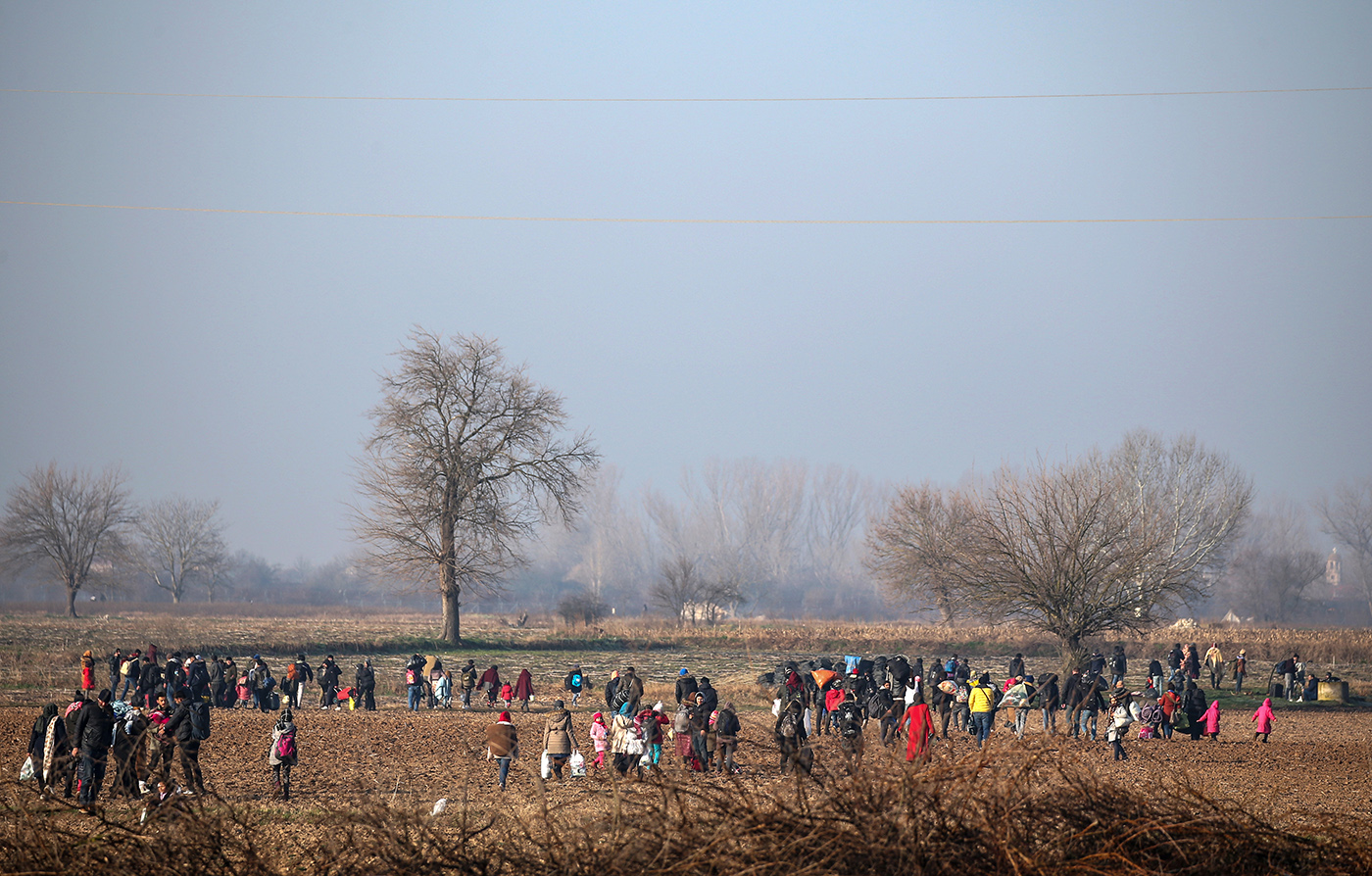 Refugees walk at the Turkish-Greek border and try to enter Europe, Edirne, Turkey, 01 March 2020. 