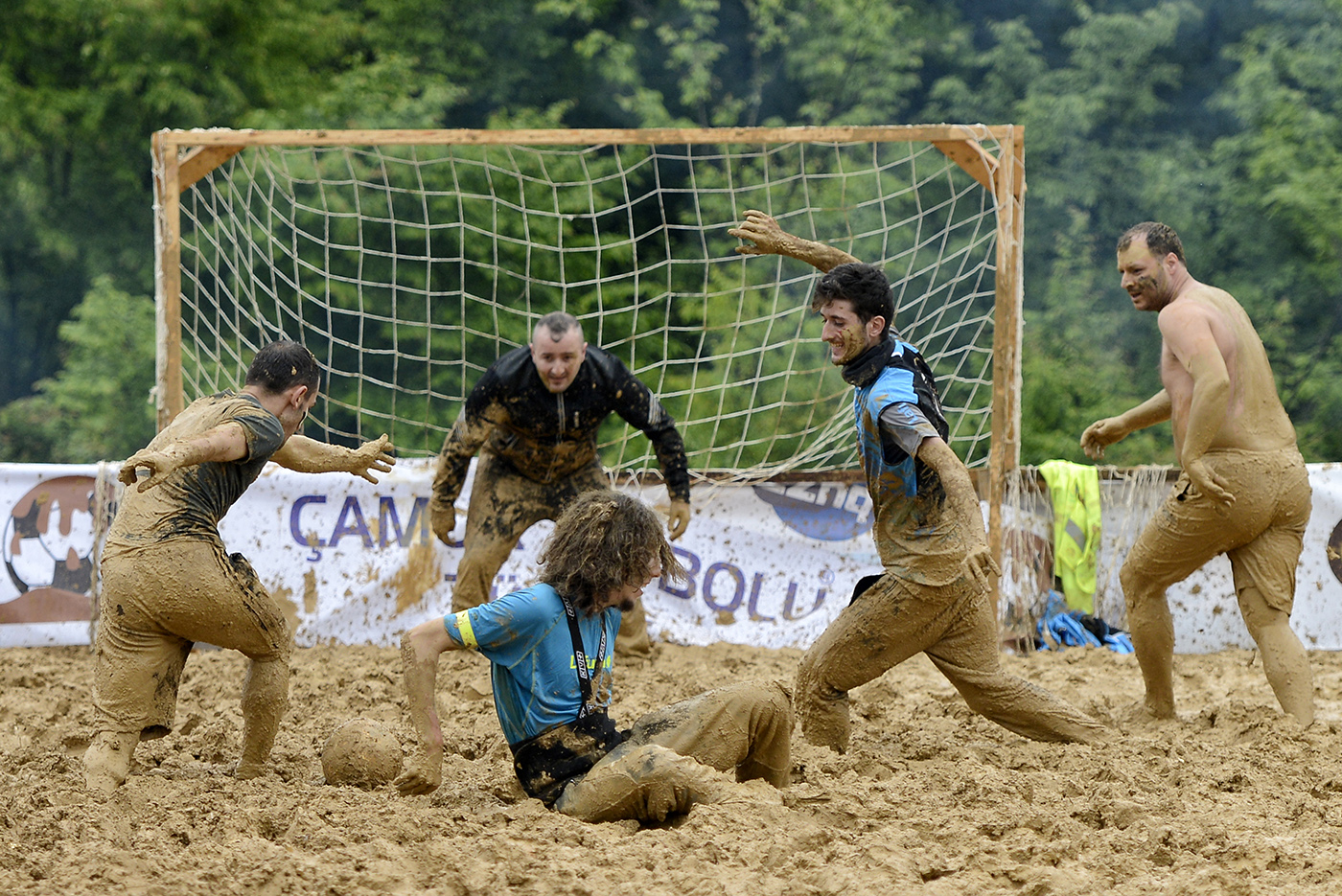 Participants in action during the Swamp Soccer event in Istanbul, Turkey 10 May 2014.