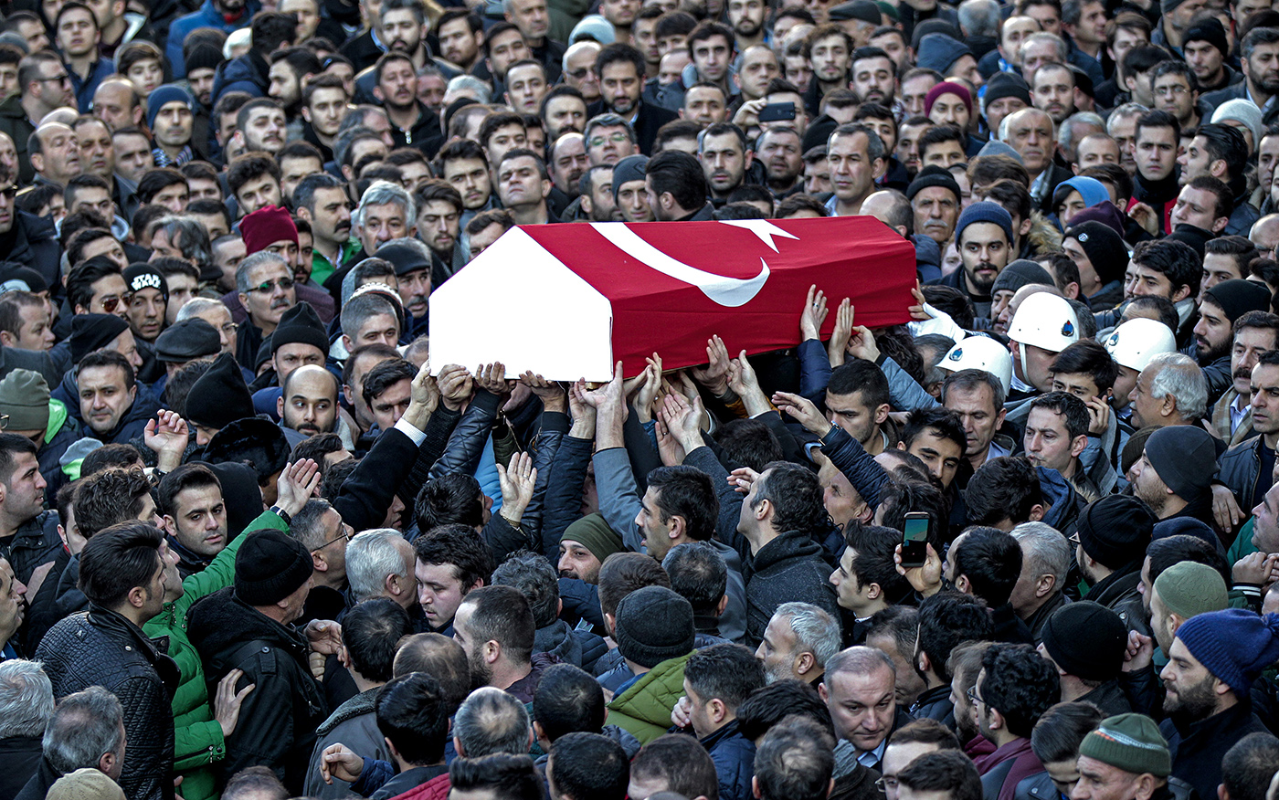 People and relatives of slain Yunus Gormek who was killed in the gun attack on the Reina night club in Istanbul on 01 January, carry his his coffin during a funeral in Istanbul, Turkey 02 January 2017.