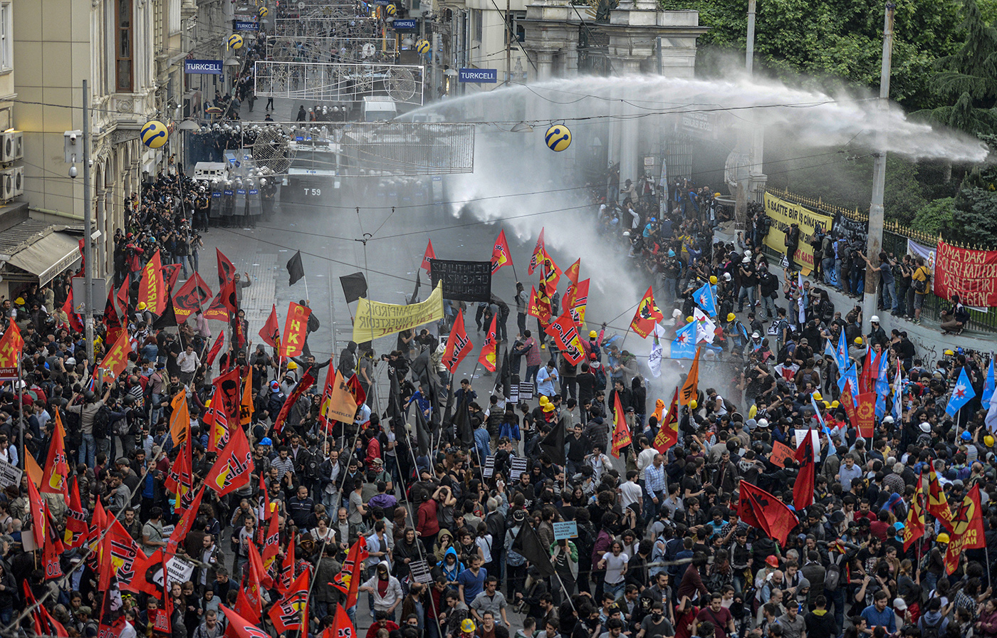 Turkish riot police use water cannon to disperse protestors as they clash during a demonstration for the victims of the Soma mine explosion, in Istanbul, Turkey, 14 May 2014.