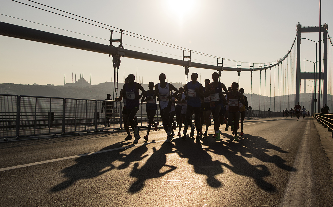Athletes run over the 15 July Martyrs bridge that links Istanbul