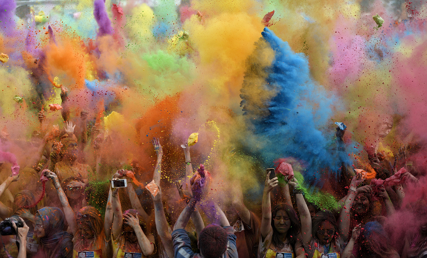 Participants throw up colored powder during the Color Up race in Istanbul, Turkey, 17 May 2015. The event is based on the Hindu Spring festival Holi, also known as the festival of colors where participants color each other with dry powder and colored water.