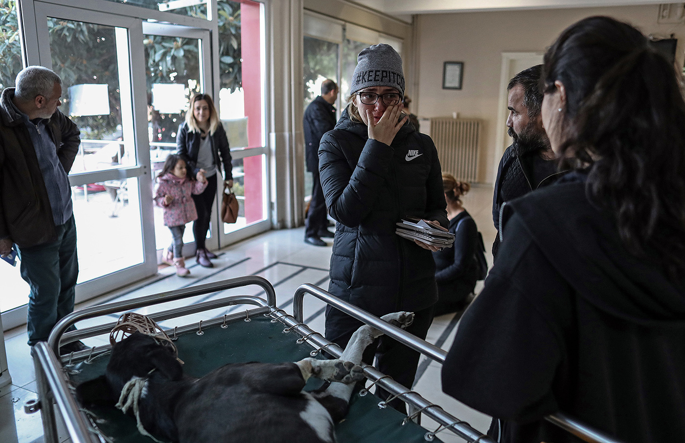 A woman cries after she has learned that her dog will remain paralysed at the Istanbul University Cerrahpasa Faculty of Veterinary Science Hospital in Istanbul, Turkey, 13 December 2018. 