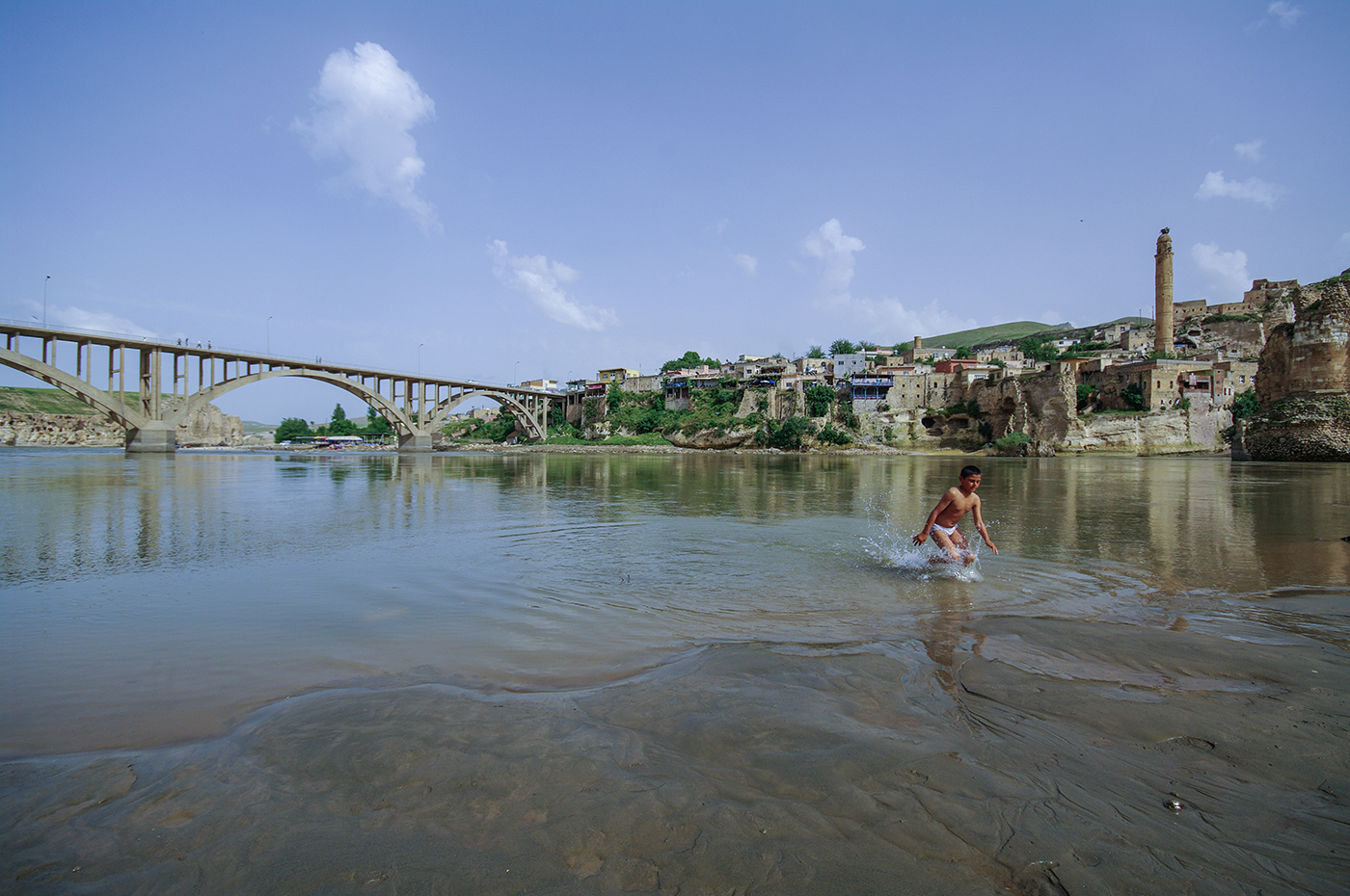 A child run in the water in Hasankeyf, an ancient city with roots going back 10,000 years and located along the Tigris (Dicle) River in south-east Turkey