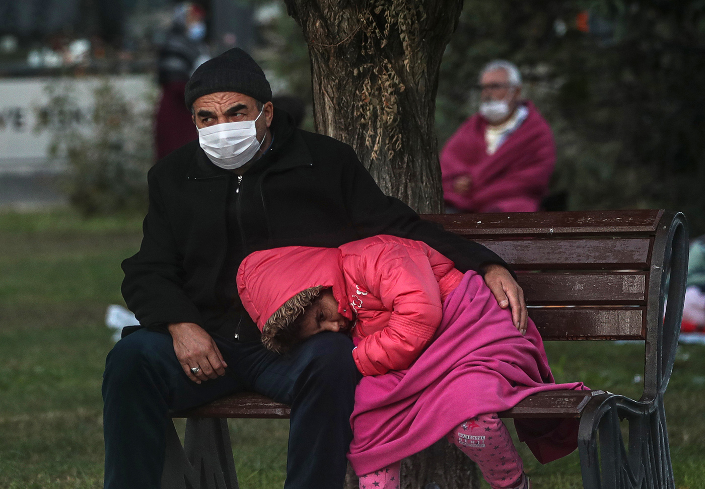 A man and a girl sit on a bench at a park after a 7.0 magnitude earthquake in the Aegean Sea, at Bayrakli district in Izmir, Turkey, 31 October 2020. According to Turkish media reports, at least twenty four people died while more than eight  hundreds were injured and dozens of buildings were destroyed in the earthquake.