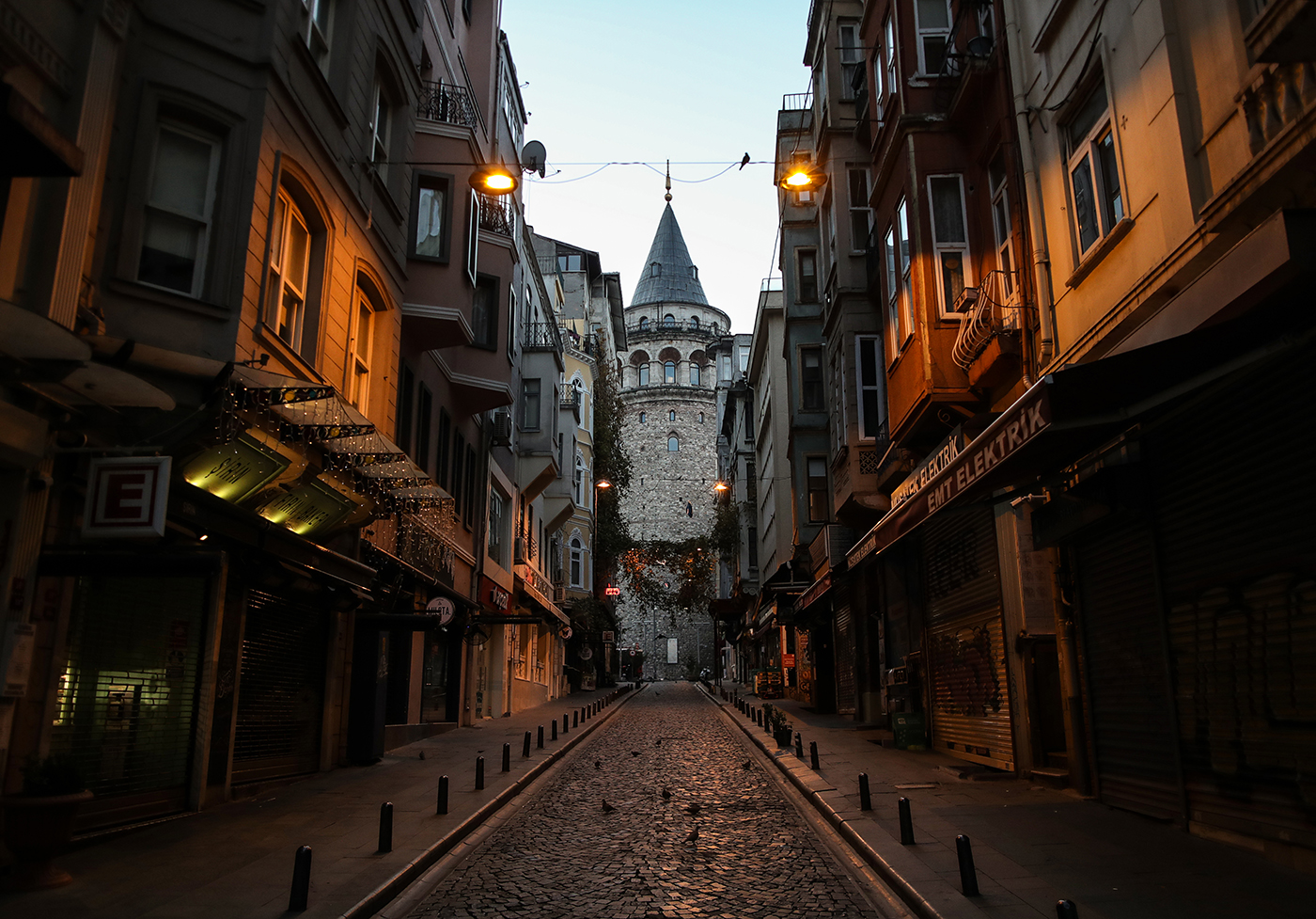 An empty street in front of the Galata Tower during a curfew in Istanbul, Turkey, 06 December 2020. Turkey will impose curfews on weekdays and full lockdowns over weekends to combat the spread of the coronavirus, President Tayyip Erdogan said on 30 November, after new cases and deaths hit records highs in recent weeks.