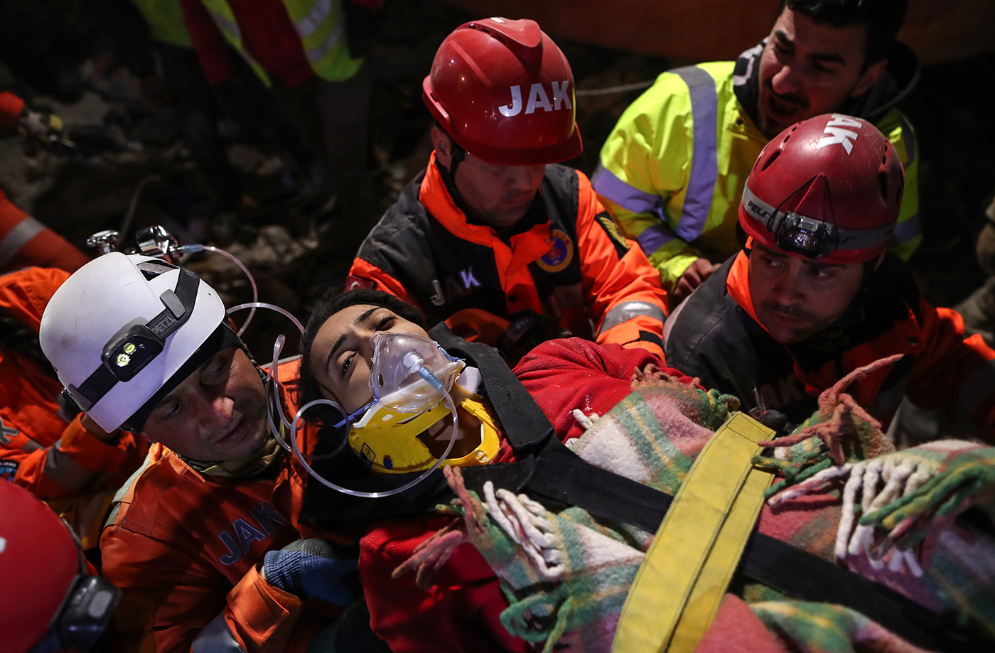 Rescue team members carry Ece Koseoglu after they evecuated her from a collapsed building after 111 hours in the aftermath of a powerful earthquake in Hatay, Turkey, 10 February 2023. More than 21,000 people have died and thousands more are injured after two major earthquakes struck southern Turkey and northern Syria on 06 February. Authorities fear the death toll will keep climbing as rescuers look for survivors across the region.