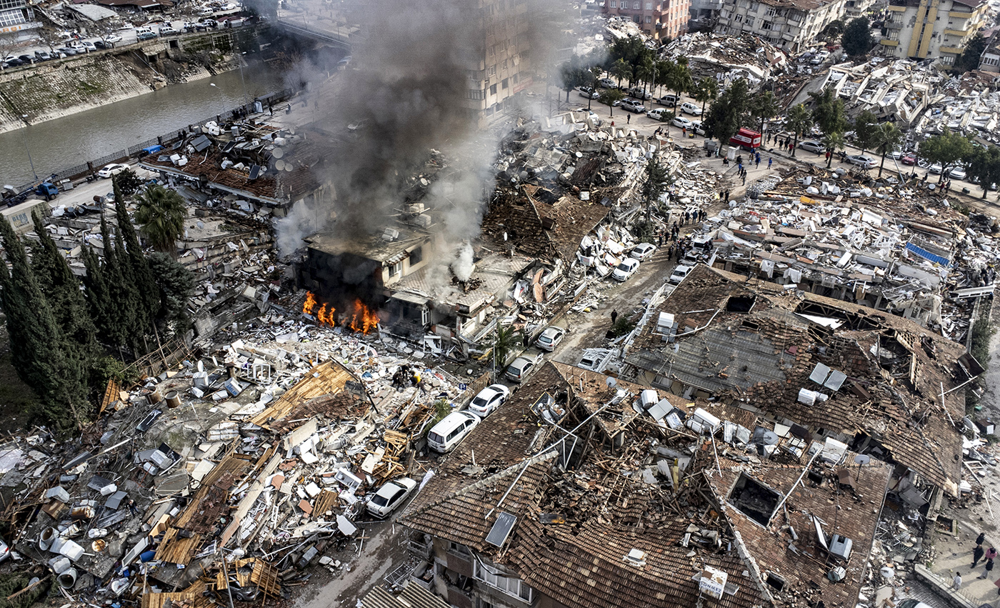 An aerial photo taken by a drone shows, emergency personnel during a search and rescue operation at the site of a collapsed building after an earthquake in Hatay, Turkey, 07 February 2023. According to the US Geological Service, an earthquake with a preliminary magnitude of 7.8 struck southern Turkey close to the Syrian border. The earthquake caused buildings to collapse and sent shockwaves over northwest Syria, Cyprus, and Lebanon. Thousands of people have died and more than seven thousand have been injured in Turkey, according to AFAD, Turkish Disaster and Emergency Management Presidency.